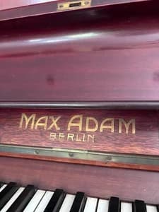 Adam Max logo